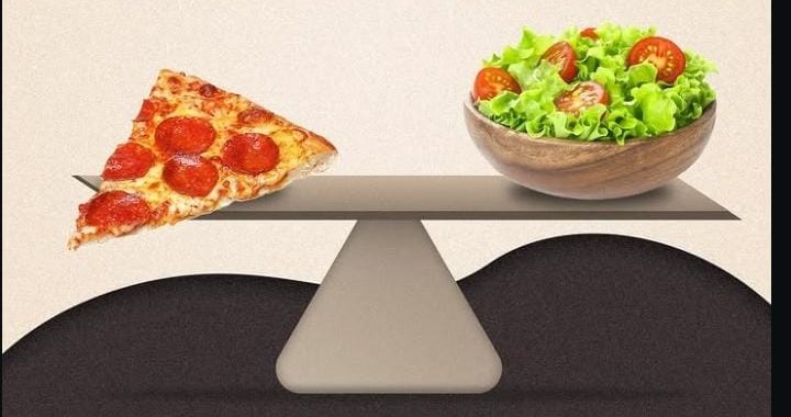 Pizza and salad balanced on a seesaw