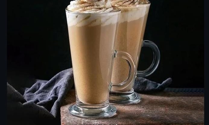 Two tall glasses of cold coffee with whipped cream