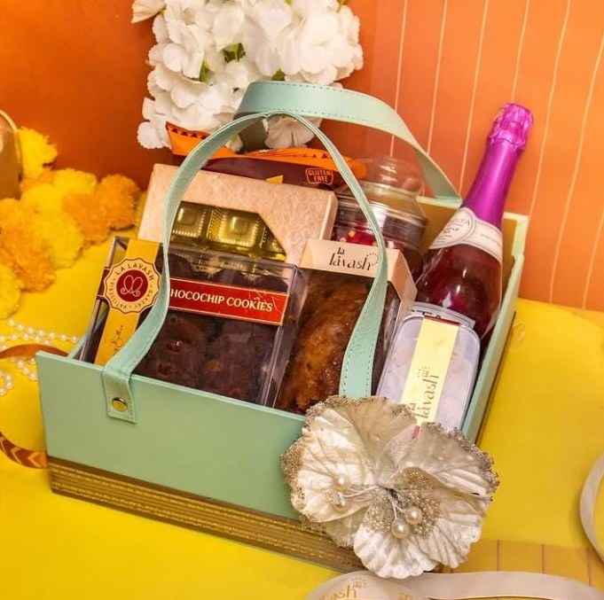 Curated gourmet gift basket with flowers