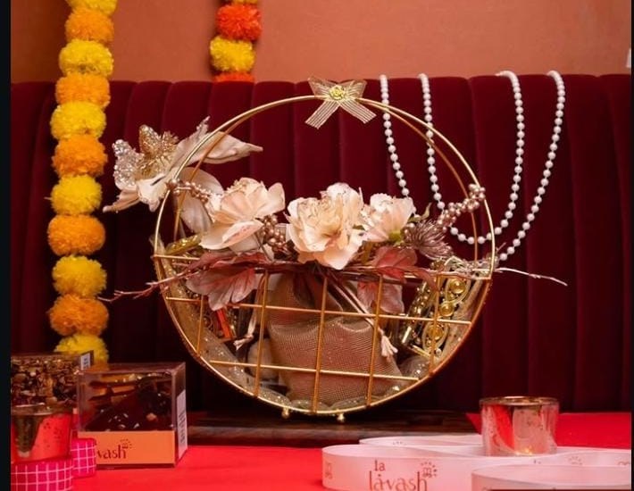 Festive marigold gift hamper arrangement