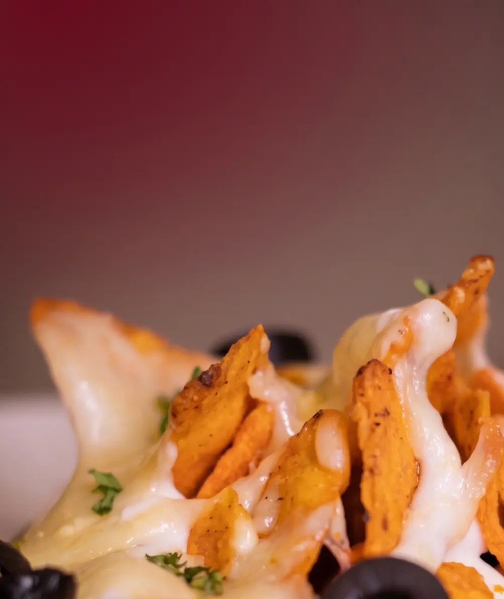 Baked nachos with cheese drizzle