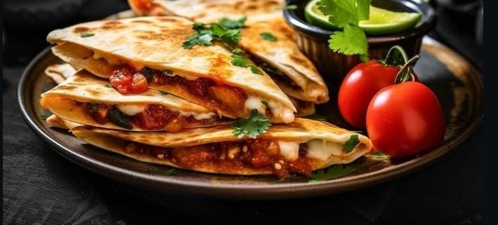Cheesy quesadillas with salsa and lime